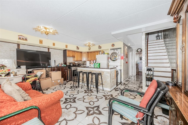 1321 Lafayette Ave, Bronx, NY 10474 - living area featuring stacked washer / drying machine