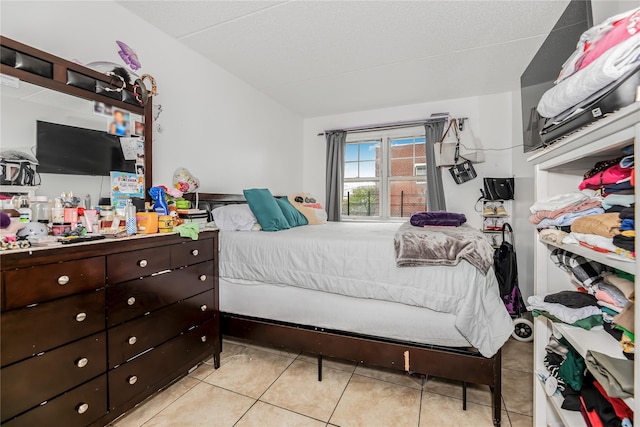 1321 Lafayette Ave, Bronx, NY 10474 - bedroom with light tile patterned floors and lofted ceiling