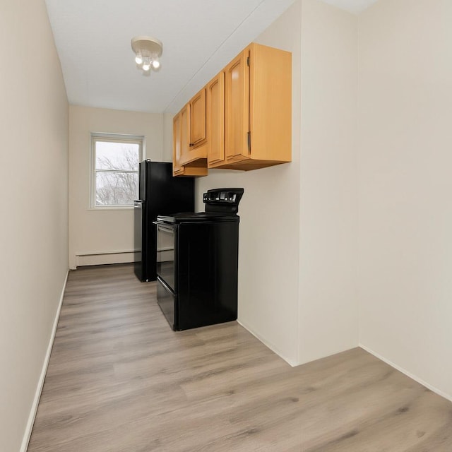 1321 Lafayette Ave, Bronx, NY 10474 - kitchen featuring black electric range oven, a baseboard heating unit, light wood-type flooring, baseboards, and light brown cabinetry