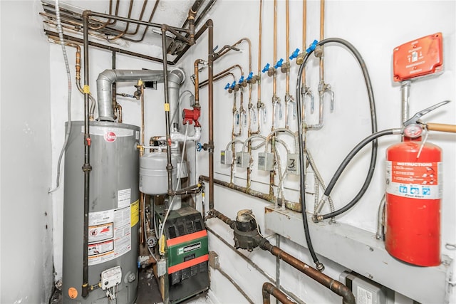 1321 Lafayette Ave, Bronx, NY 10474 - utility room featuring water heater and a heating unit