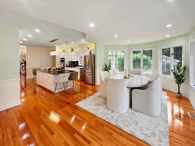 91 Harbor Rd, Head Of The Harbor, NY 11780 - dining area featuring light wood finished floors, recessed lighting, and baseboards