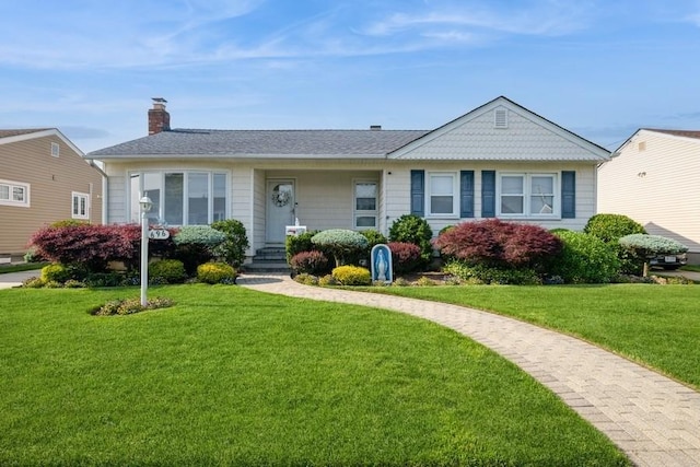 696 Byron Ave, Franklin Square, NY 11010 - view of front facade featuring a chimney, a front yard, and a shingled roof
