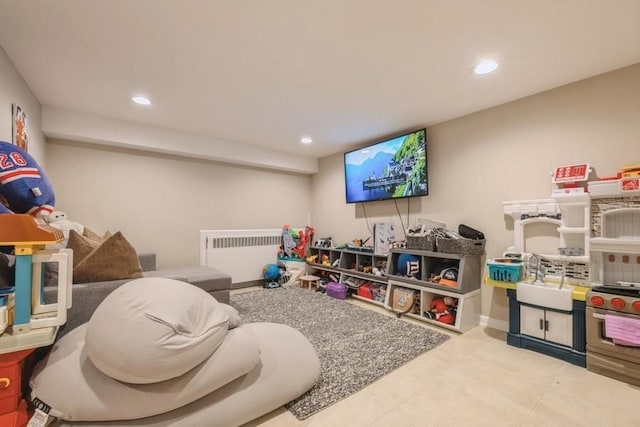 696 Byron Ave, Franklin Square, NY 11010 - playroom featuring radiator heating unit, tile patterned flooring, and recessed lighting