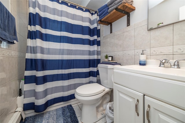 721 E Walnut St, Long Beach, NY 11561 - full bathroom featuring tile walls, toilet, vanity, backsplash, and a baseboard radiator