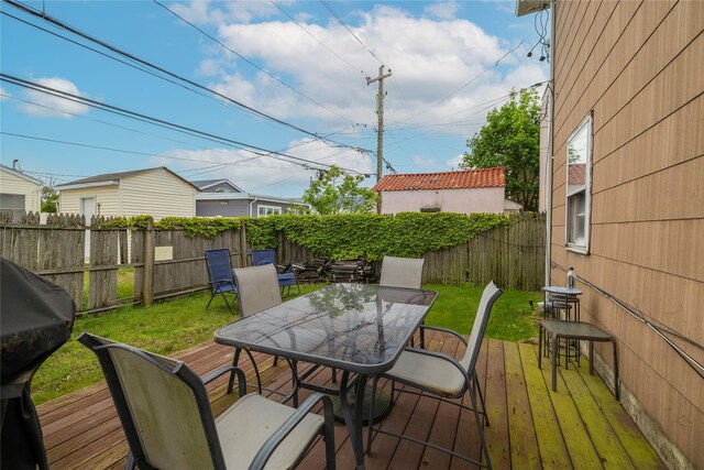 721 E Walnut St, Long Beach, NY 11561 - wooden terrace featuring outdoor dining space