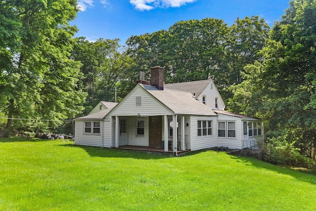 3868 Indian Hill Rd, Shrub Oak, NY 10588 - view of front of home featuring a chimney, a front lawn, a shingled roof, and a porch