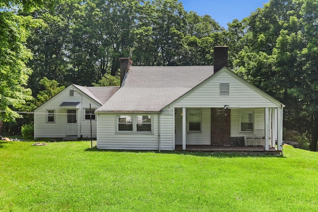 3868 Indian Hill Rd, Shrub Oak, NY 10588 - view of front of home featuring a chimney, a front lawn, a porch, and roof with shingles