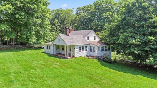 3868 Indian Hill Rd, Shrub Oak, NY 10588 - rear view of house with a chimney, a yard, and roof with shingles