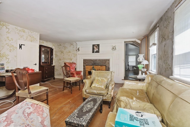 3868 Indian Hill Rd, Shrub Oak, NY 10588 - living room featuring wallpapered walls, wood finished floors, and a fireplace
