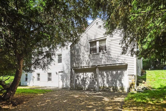 3868 Indian Hill Rd, Shrub Oak, NY 10588 - view of front facade featuring driveway and a garage