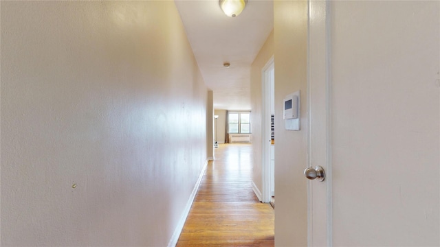 65-35 108th St Unit D7, Forest Hills, NY 11375 - hallway with baseboards and light wood-style flooring