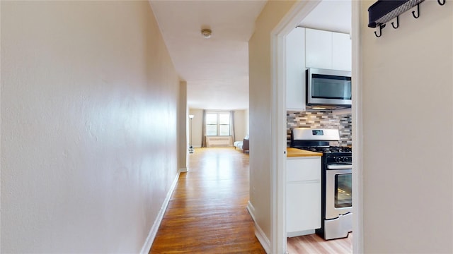 65-35 108th St Unit D7, Forest Hills, NY 11375 - corridor featuring light wood-type flooring and baseboards