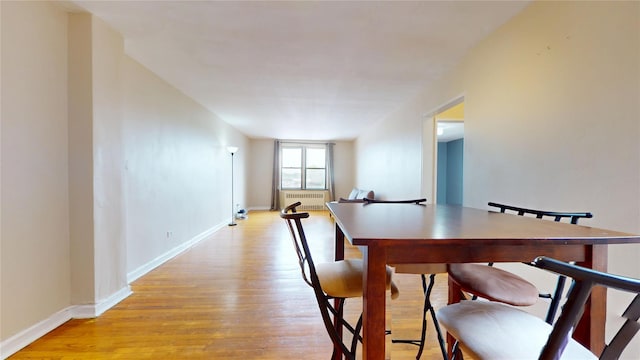 65-35 108th St Unit D7, Forest Hills, NY 11375 - dining room with light wood finished floors, baseboards, and radiator