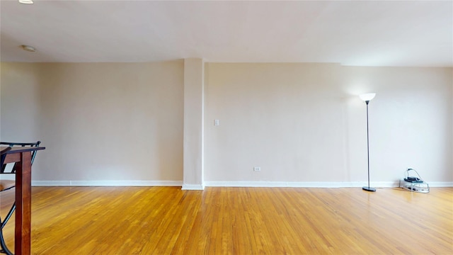 65-35 108th St Unit D7, Forest Hills, NY 11375 - empty room with light wood finished floors, baseboards, and a smoke detector