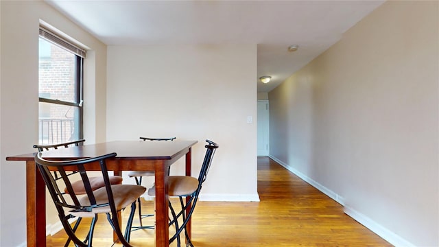 65-35 108th St Unit D7, Forest Hills, NY 11375 - dining area with light wood-style floors and baseboards