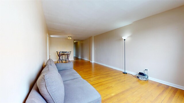 65-35 108th St Unit D7, Forest Hills, NY 11375 - living room featuring light wood-style floors and baseboards