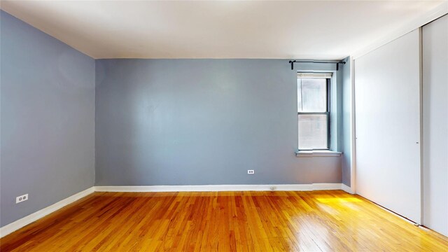 65-35 108th St Unit D7, Forest Hills, NY 11375 - unfurnished room with light wood-style flooring and baseboards