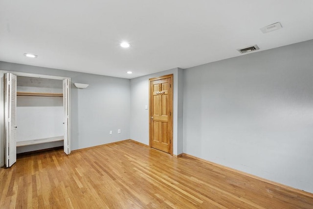 73 Fox Pl, Hicksville, NY 11801 - unfurnished bedroom featuring light wood-style flooring, recessed lighting, baseboards, and a closet