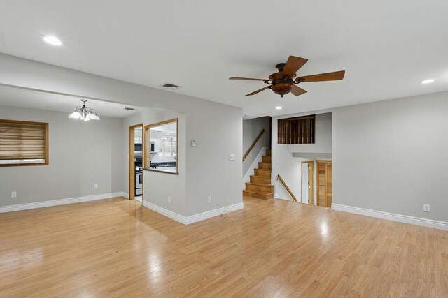 73 Fox Pl, Hicksville, NY 11801 - unfurnished living room featuring a ceiling fan, light wood-style flooring, recessed lighting, and baseboards