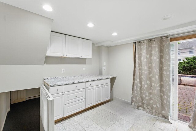 73 Fox Pl, Hicksville, NY 11801 - kitchen featuring white cabinetry, light stone counters, and recessed lighting