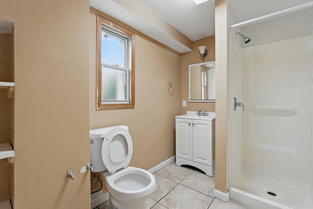 73 Fox Pl, Hicksville, NY 11801 - bathroom featuring a stall shower, vanity, tile patterned floors, and baseboards