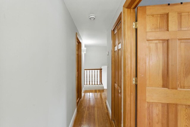 73 Fox Pl, Hicksville, NY 11801 - hallway featuring wood finished floors and baseboards