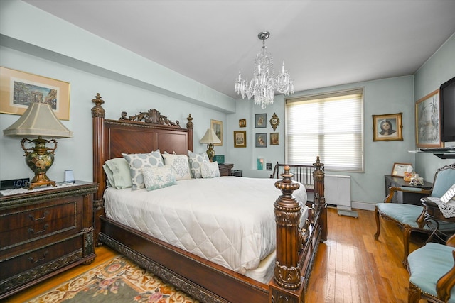 211-40 18th Ave Unit 4A, Bayside, NY 11360 - bedroom with a chandelier and wood-type flooring