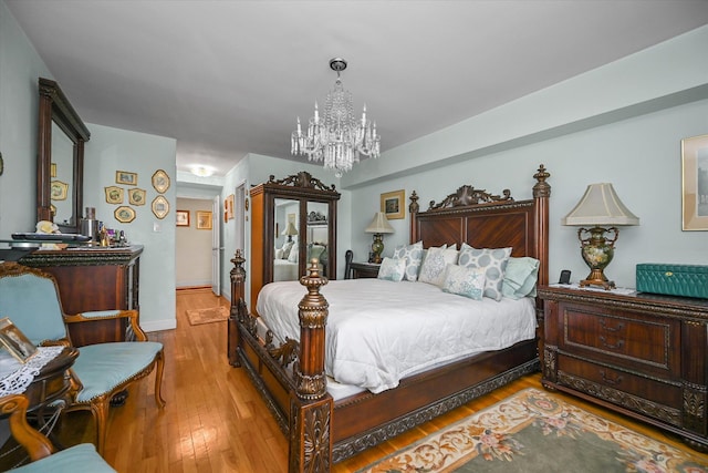 211-40 18th Ave Unit 4A, Bayside, NY 11360 - bedroom featuring a chandelier and wood-type flooring