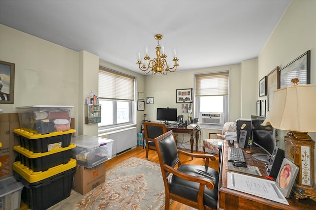 211-40 18th Ave Unit 4A, Bayside, NY 11360 - home office with wood finished floors, plenty of natural light, a chandelier, and cooling unit