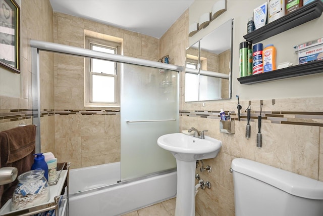 211-40 18th Ave Unit 4A, Bayside, NY 11360 - bathroom featuring shower / bath combination with glass door and tile walls