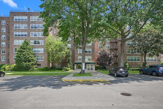 211-40 18th Ave Unit 4A, Bayside, NY 11360 - view of apartment building / complex featuring uncovered parking