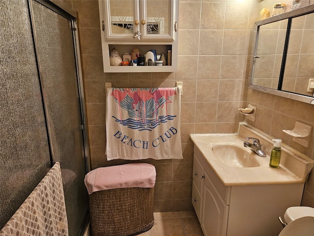 199-06 24th Rd, Whitestone, NY 11357 - full bath featuring tile walls, vanity, a stall shower, tile patterned floors, and toilet