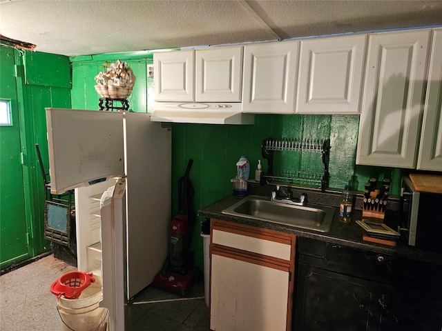 199-06 24th Rd, Whitestone, NY 11357 - kitchen with white cabinets, a sink, dark countertops, and freestanding refrigerator