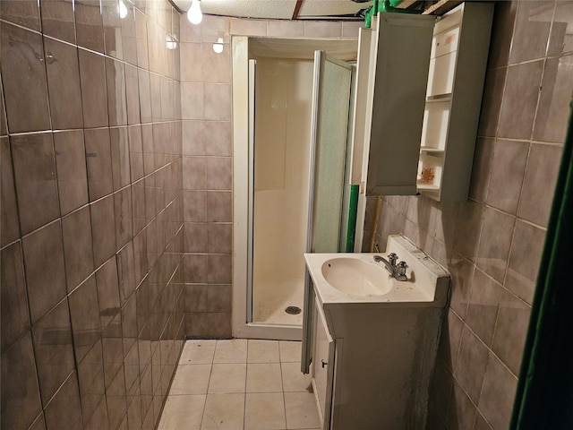 199-06 24th Rd, Whitestone, NY 11357 - bathroom featuring a shower stall, vanity, tile patterned floors, and tile walls