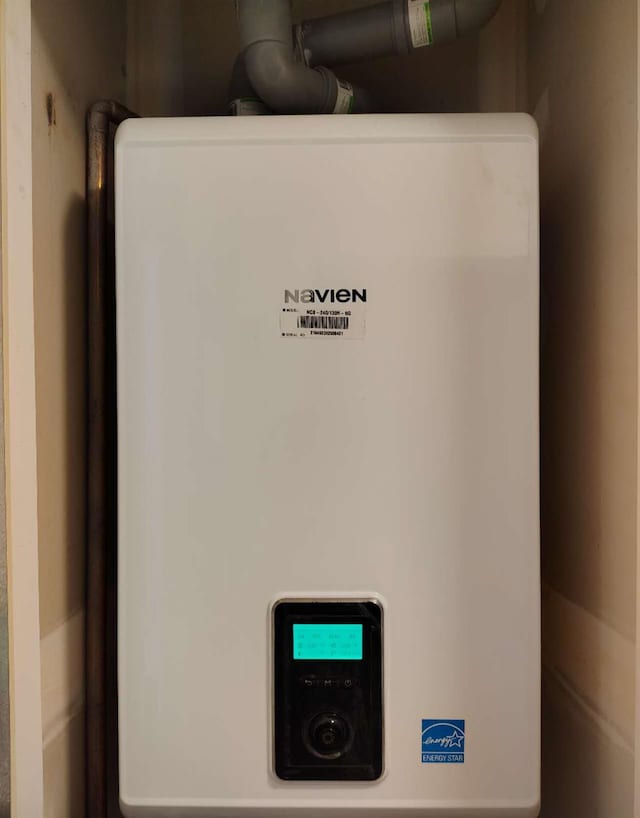 2-18A Constitution Pl Unit 173, College Point, NY 11356 - utility room featuring tankless water heater