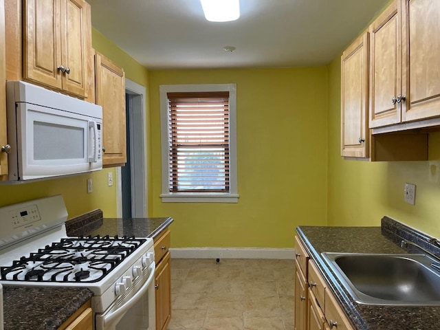 604 Tompkins Ave Unit B-2, Mamaroneck, NY 10543 - kitchen featuring white appliances and dark stone countertops