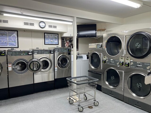604 Tompkins Ave Unit B-2, Mamaroneck, NY 10543 - shared laundry featuring washer and clothes dryer, stacked washer and clothes dryer, and tile patterned floors