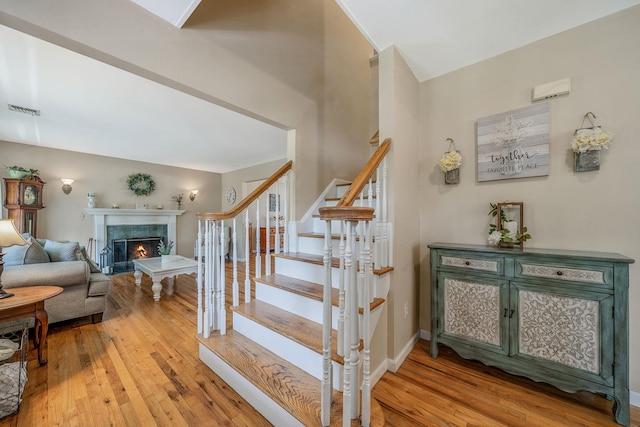 4 Ariel Ct, Rocky Point, NY 11778 - stairway with hardwood / wood-style flooring and a high end fireplace