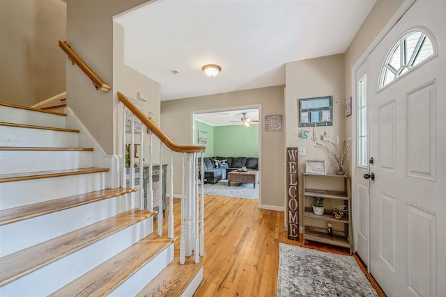 4 Ariel Ct, Rocky Point, NY 11778 - entryway with wood-type flooring, stairway, and ceiling fan