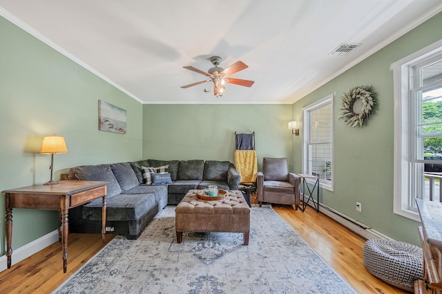 4 Ariel Ct, Rocky Point, NY 11778 - living room featuring ornamental molding, wood finished floors, a ceiling fan, and a baseboard heating unit