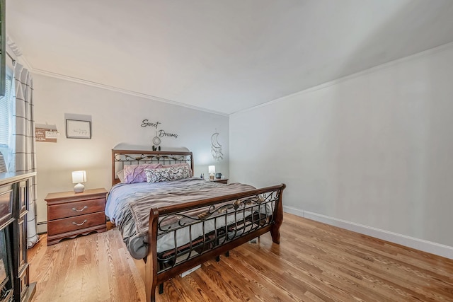 4 Ariel Ct, Rocky Point, NY 11778 - bedroom featuring crown molding and light wood-style flooring