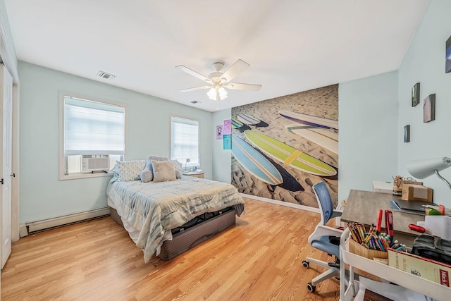 4 Ariel Ct, Rocky Point, NY 11778 - bedroom with a baseboard heating unit, wood finished floors, and ceiling fan