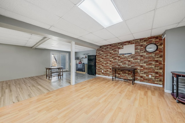 4 Ariel Ct, Rocky Point, NY 11778 - unfurnished living room with a paneled ceiling and wood finished floors