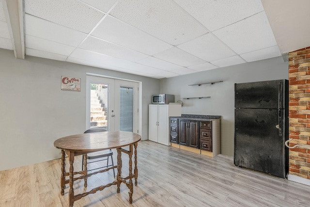 4 Ariel Ct, Rocky Point, NY 11778 - kitchen featuring freestanding refrigerator, a drop ceiling, light wood-style flooring, french doors, and stainless steel microwave