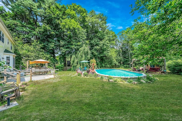 4 Ariel Ct, Rocky Point, NY 11778 - view of green lawn featuring an outdoor pool and view of scattered trees