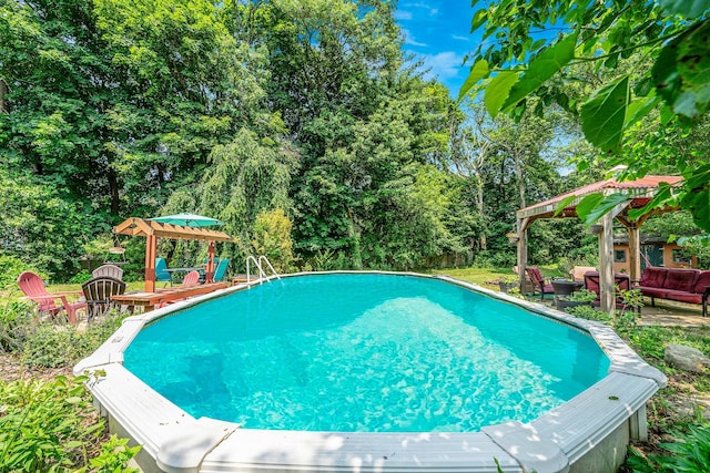 4 Ariel Ct, Rocky Point, NY 11778 - swimming pool featuring a gazebo, an outdoor hangout area, a patio area, and view of wooded area