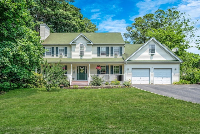 4 Ariel Ct, Rocky Point, NY 11778 - colonial home featuring driveway, covered porch, a chimney, and a front lawn