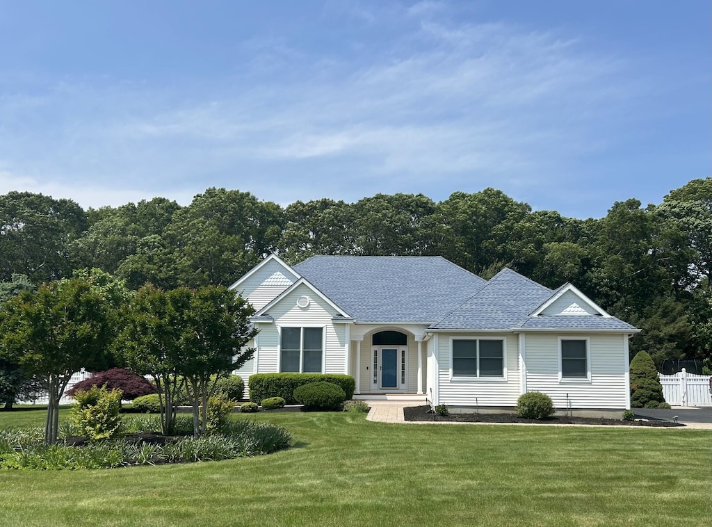 39 Hidden Pond Path, Wading River, NY 11792 - view of front facade featuring roof with shingles