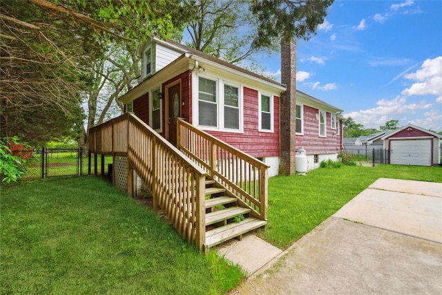 80 Diana Dr, Mastic Beach, NY 11951 - view of front of property featuring a garage, concrete driveway, a gate, and an outdoor structure
