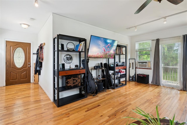 80 Diana Dr, Mastic Beach, NY 11951 - foyer featuring rail lighting, wood-type flooring, a ceiling fan, and cooling unit